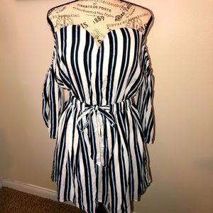Never-worn, sweetheart style neckline peplum tunic. Off-shoulder attached sleeve